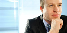 Headshot of a professionally dressed man with a contemplative look